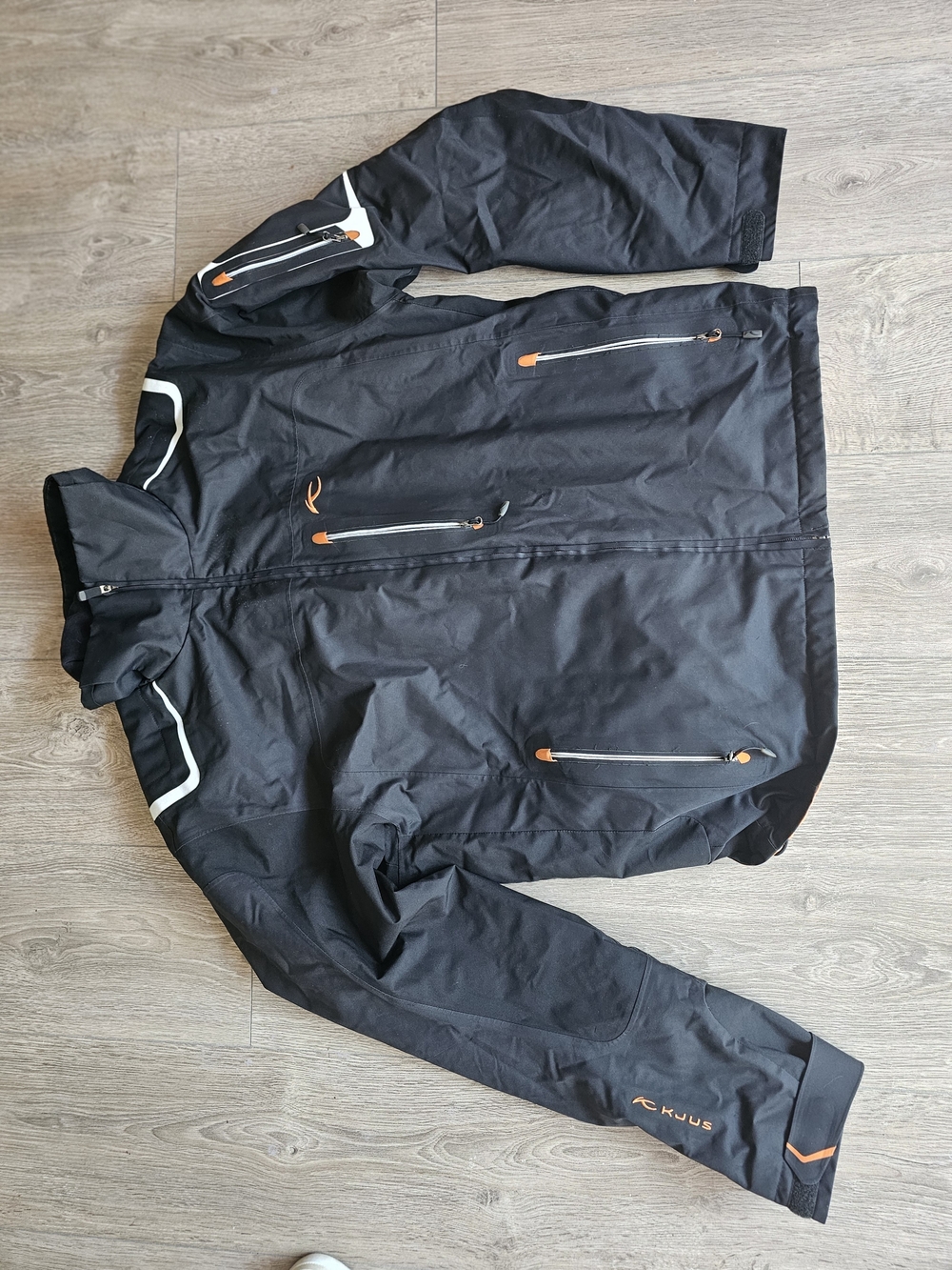 Men's Black Ski Jacket with Orange Accents by KJUS